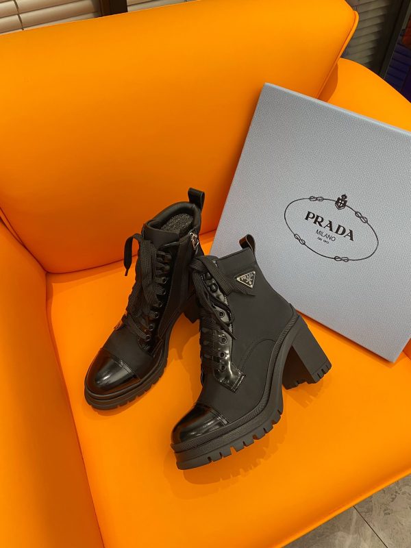 PRADA LOGO PLAQUE ANKLE BOOTS BLACK