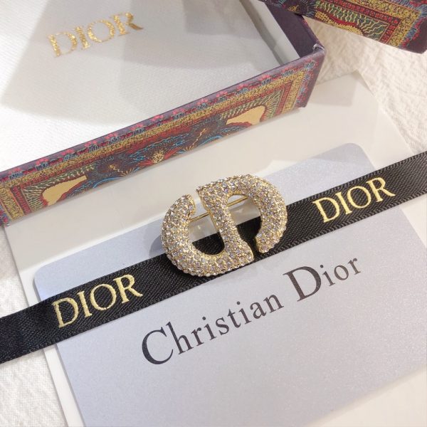 DIOR CD BROOCH GOLD WITH STONES ATTACHED