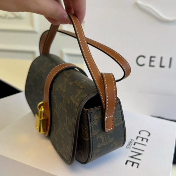 CELINE CLUTCH ON STRAP TABOU IN TRIOMPHE CANVAS AND CALFSKIN TAN 20CM 10I592DQ2 04LU