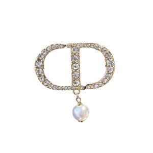 DIOR CD BROOCH GOLD WITH A PEARL