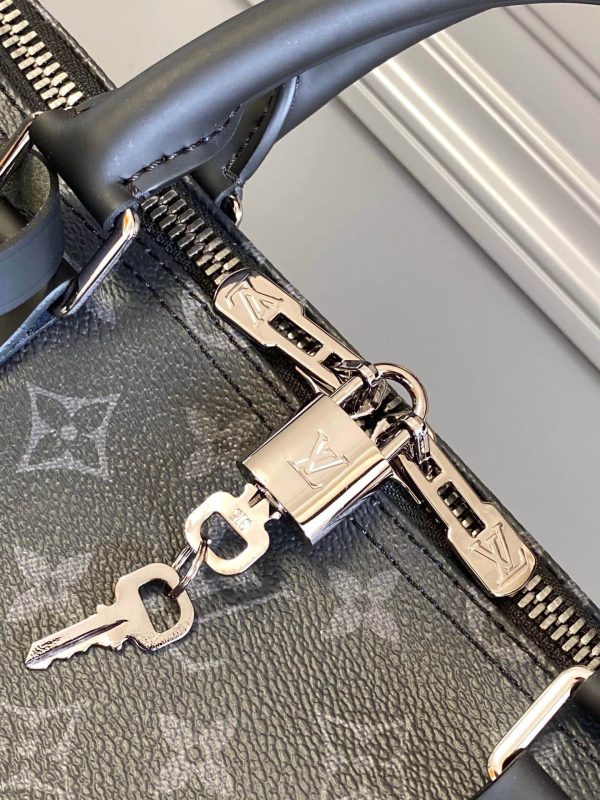 SUMMER SET: LOUIS VUITTON KEEPALL BANDOULIÈRE 50 MONOGRAM ECLIPSE & LONG WALLET MONOGRAM ECLIPSE TRUNK ZIPPY BLACK 19CM