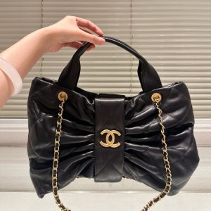CHANEL MAXI BOW BAG SHINY AND GOLD TONE METAL BLACK 51CM